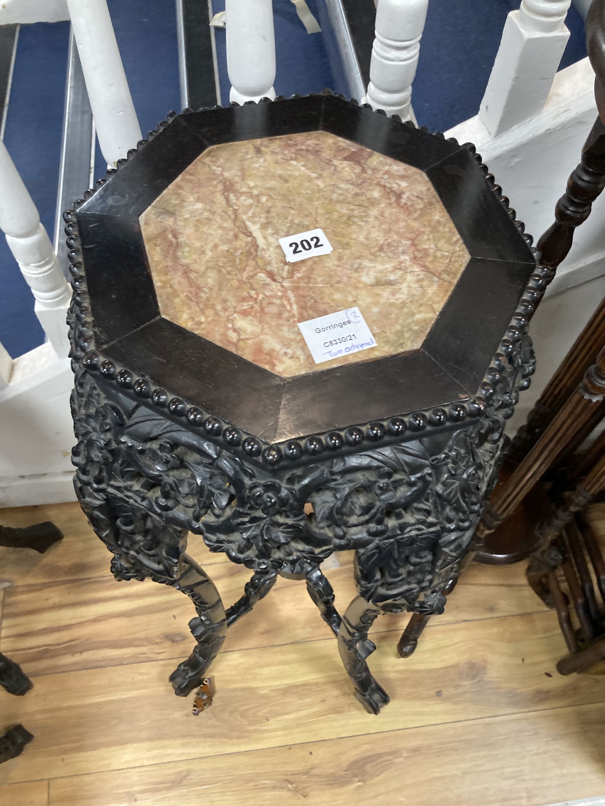 Two Chinese hongmu and marble inset octagonal stands, late 19th century, largest width 40cm height 90cm